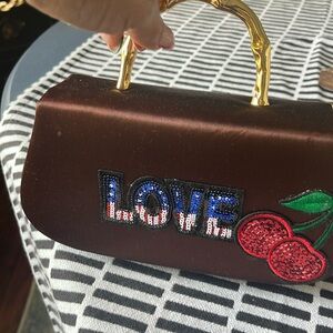 Small Brown purse from Dyeables. Adorned with patches